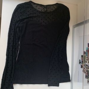 Black top with sheer pattern sleeves
